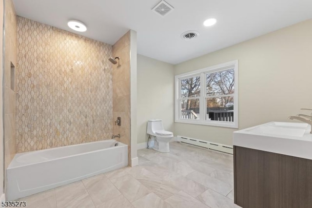 full bathroom featuring toilet, a baseboard radiator, vanity, tiled shower / bath combo, and tile patterned flooring