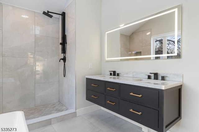 bathroom featuring vanity, vaulted ceiling, and tiled shower