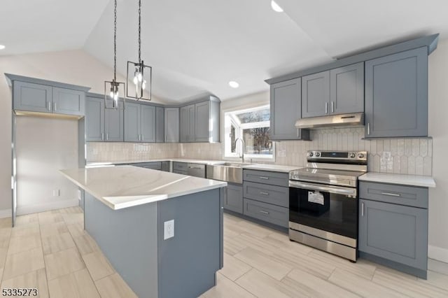 kitchen featuring vaulted ceiling, pendant lighting, sink, stainless steel range with electric stovetop, and a center island