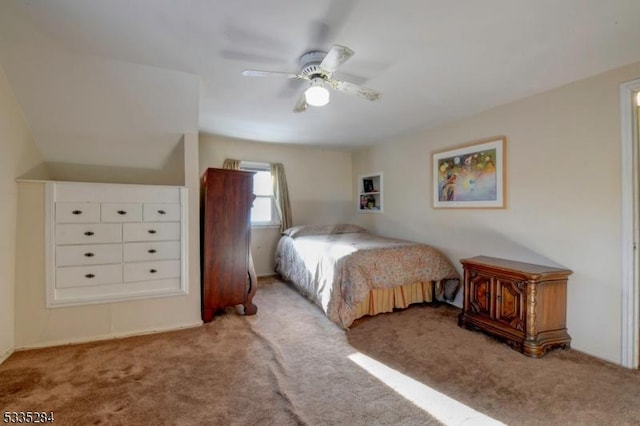 bedroom with ceiling fan and light colored carpet