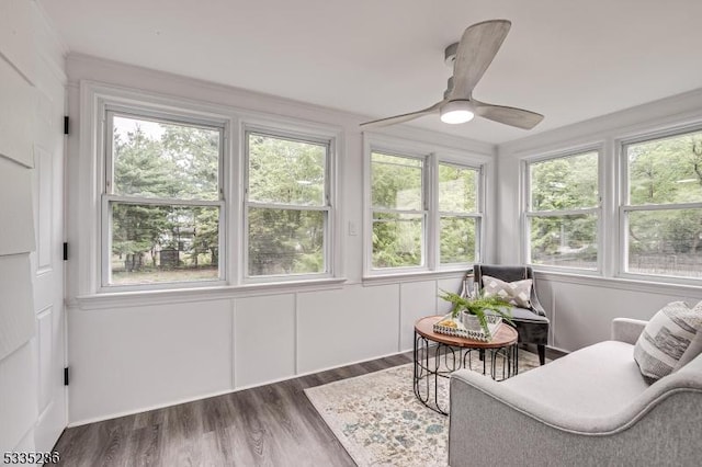 sunroom / solarium featuring a wealth of natural light and ceiling fan