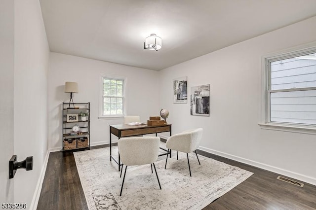 office space with dark hardwood / wood-style flooring