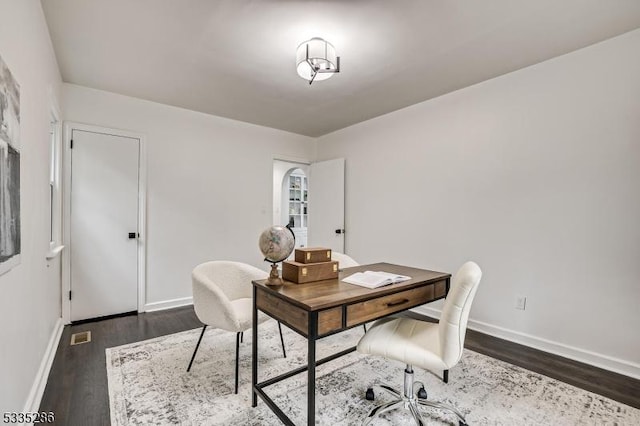 office space with dark hardwood / wood-style floors