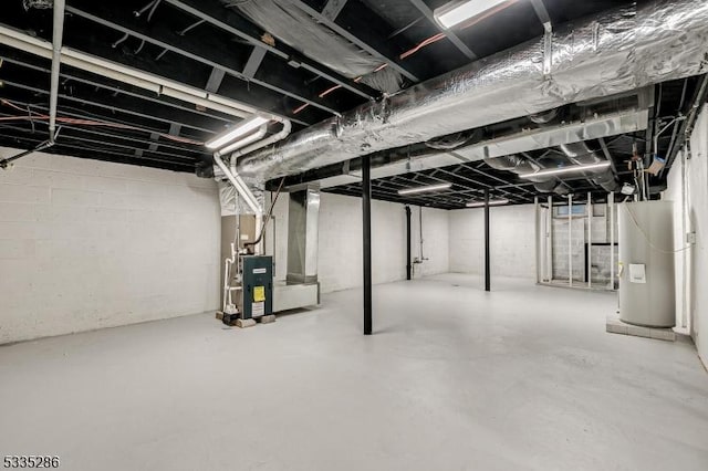 basement with electric water heater and heating unit