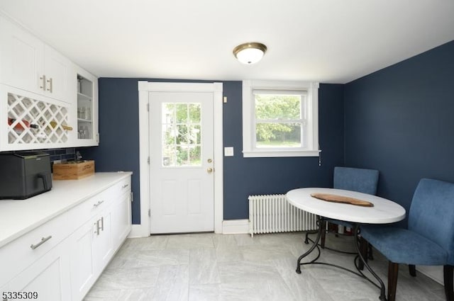 dining room featuring radiator heating unit