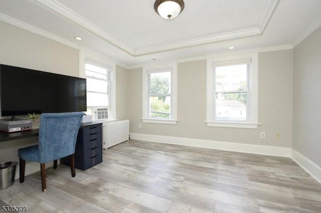 home office with ornamental molding, radiator, a raised ceiling, and light hardwood / wood-style flooring