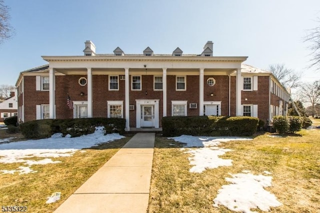 greek revival house with a front yard