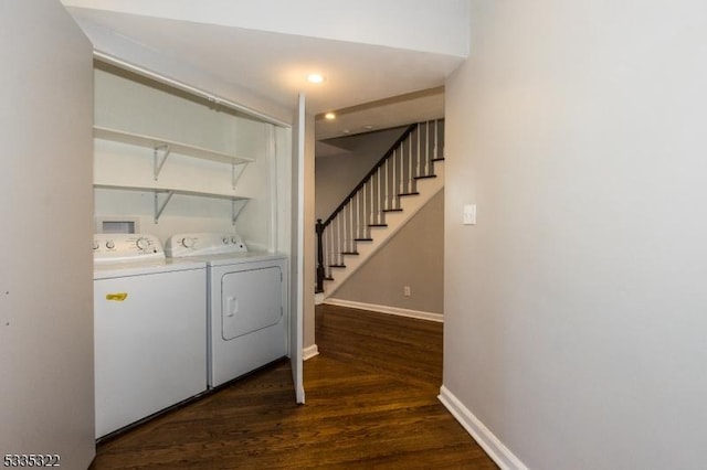 laundry room featuring washer and dryer and dark hardwood / wood-style flooring