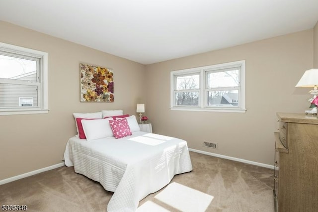 bedroom with light colored carpet