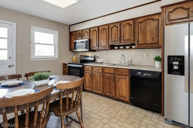 kitchen featuring appliances with stainless steel finishes, sink, and backsplash