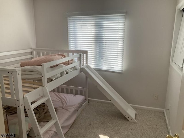 unfurnished bedroom featuring light colored carpet