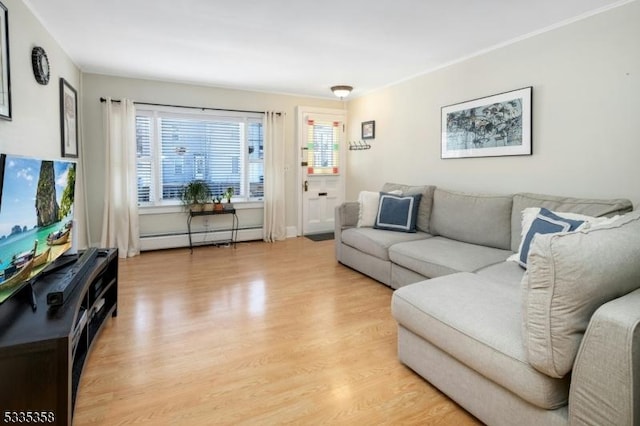 living room featuring light wood-type flooring and baseboard heating