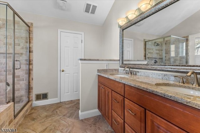 bathroom featuring lofted ceiling, vanity, and walk in shower