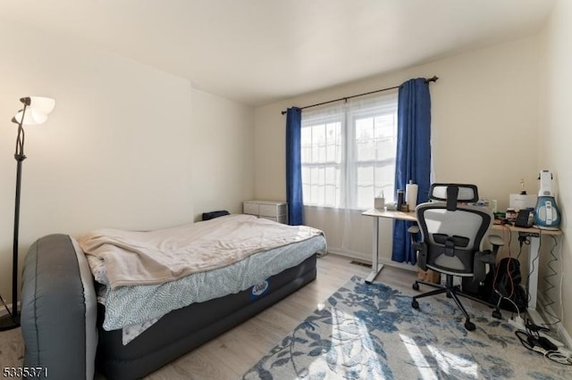 bedroom with light wood-type flooring