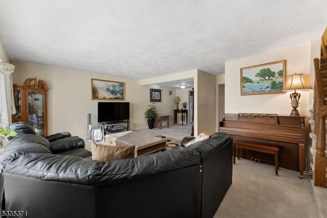 living room with light colored carpet and a textured ceiling