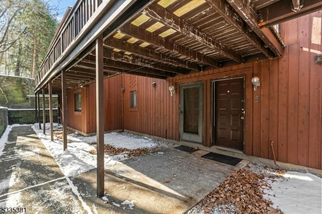 view of snow covered property entrance