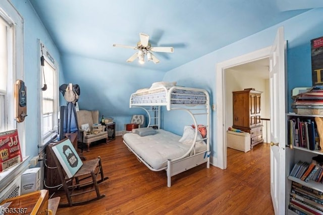 bedroom with dark wood-type flooring and ceiling fan