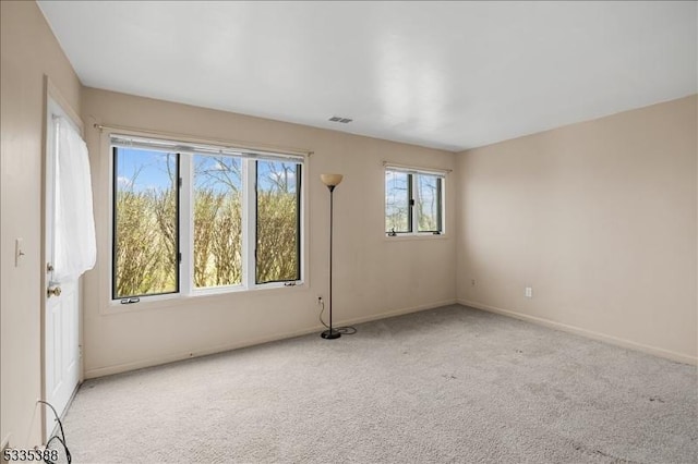 empty room with light colored carpet