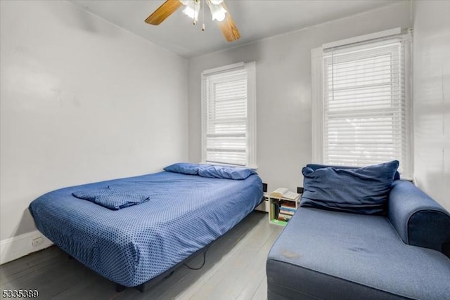 bedroom with wood-type flooring and ceiling fan