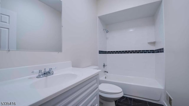 full bathroom featuring vanity, bathing tub / shower combination, and toilet