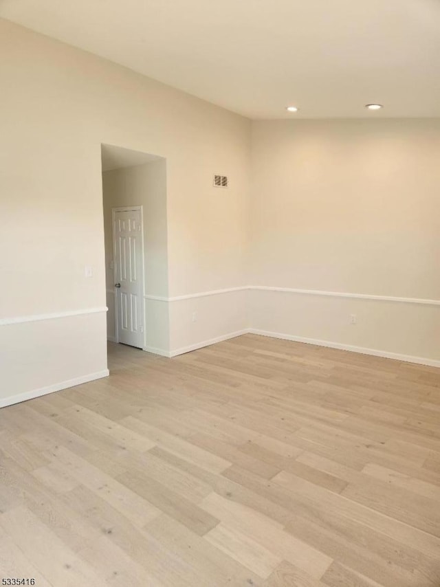 unfurnished room with light hardwood / wood-style floors