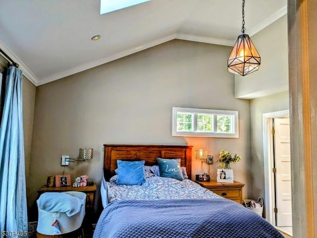 bedroom with lofted ceiling and ornamental molding