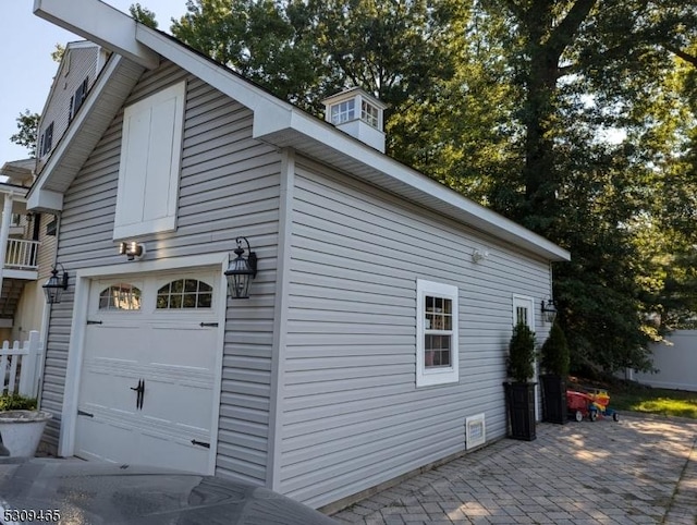 view of side of property featuring a garage