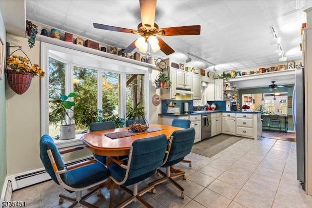 dining space featuring light tile patterned floors, ceiling fan, and track lighting