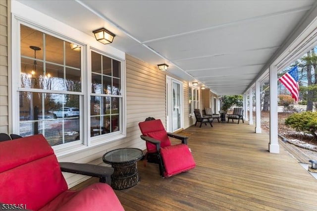 wooden deck featuring covered porch