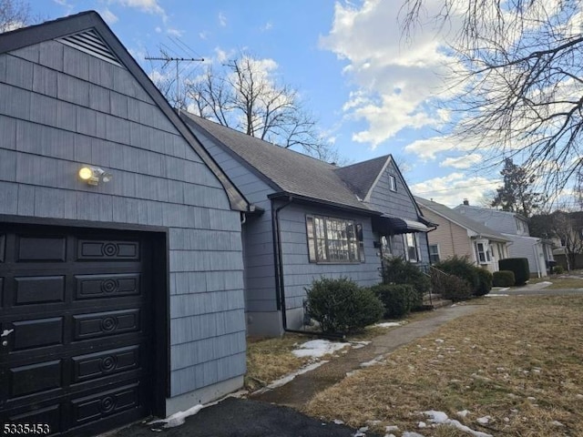 view of side of property featuring a garage