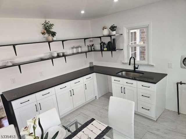 kitchen with sink and white cabinets