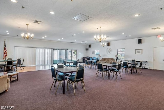 dining space featuring dark carpet, a textured ceiling, and an inviting chandelier