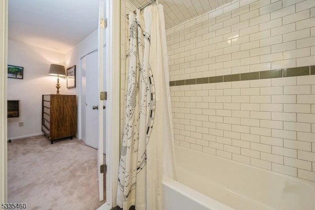 bathroom featuring shower / bathtub combination with curtain