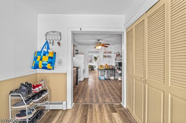 hallway featuring hardwood / wood-style flooring and a baseboard radiator