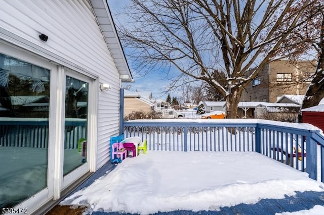 view of snow covered deck