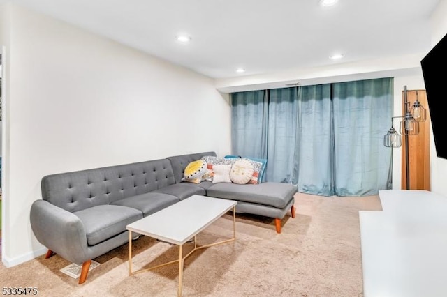 living room featuring light colored carpet