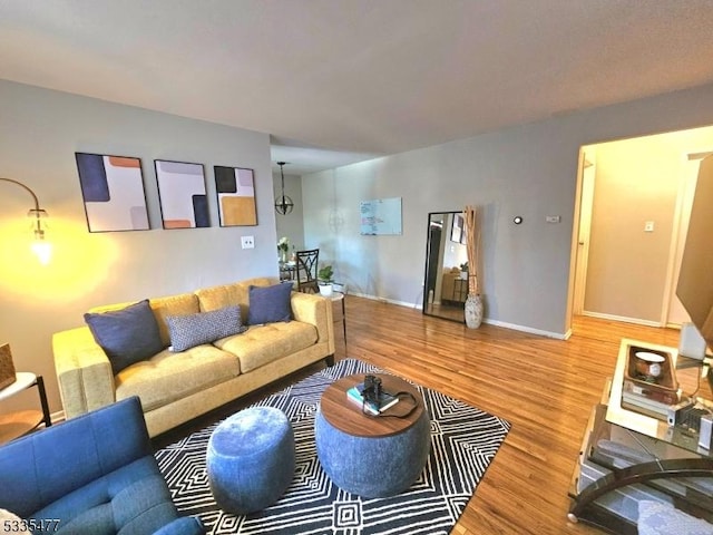 living room featuring wood finished floors and baseboards