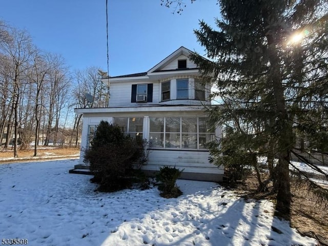 front facade with a sunroom