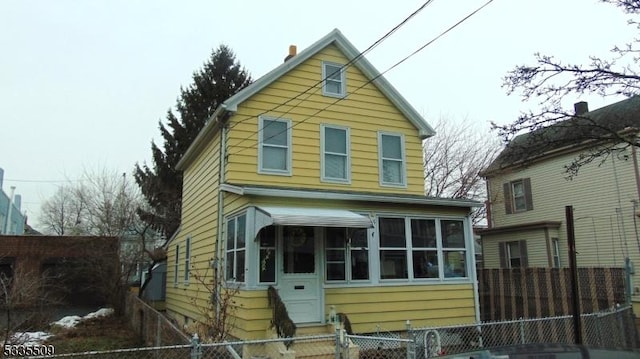 view of front facade featuring a sunroom