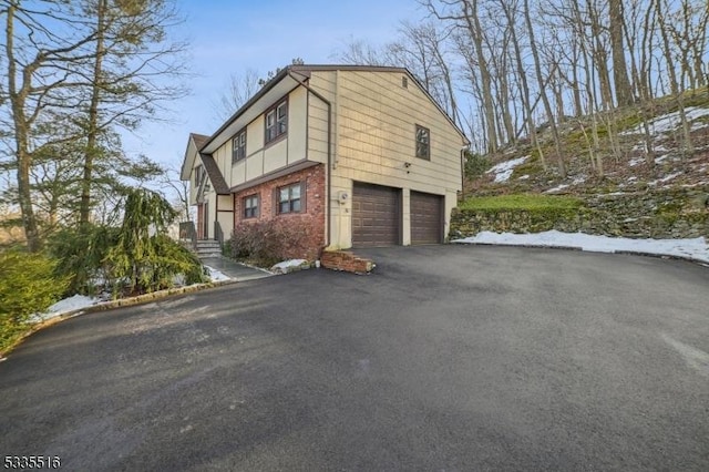 view of property exterior with a garage