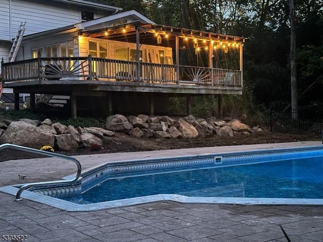 view of swimming pool featuring a sunroom