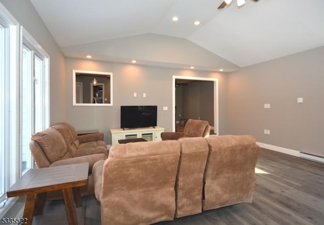 living room featuring ceiling fan, lofted ceiling, a healthy amount of sunlight, and dark hardwood / wood-style floors