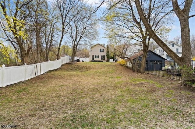 view of yard with a fenced backyard