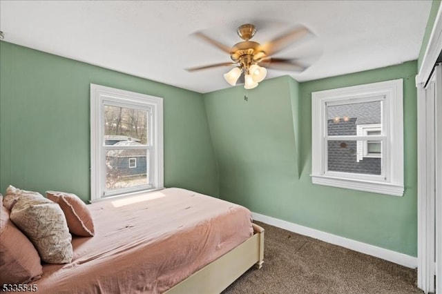 bedroom with baseboards, carpet floors, and ceiling fan