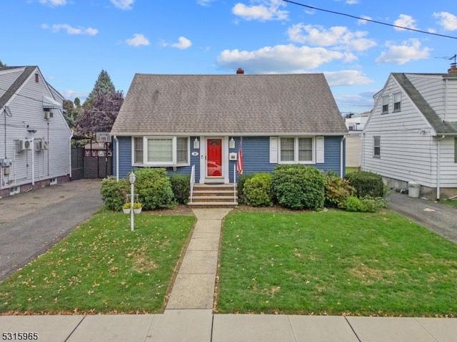 bungalow-style home featuring a front lawn