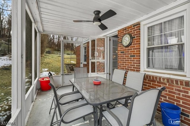 sunroom / solarium with ceiling fan