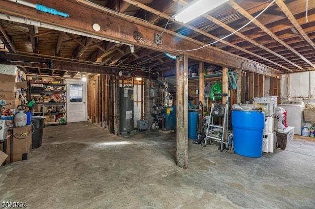 basement with washer and dryer and water heater