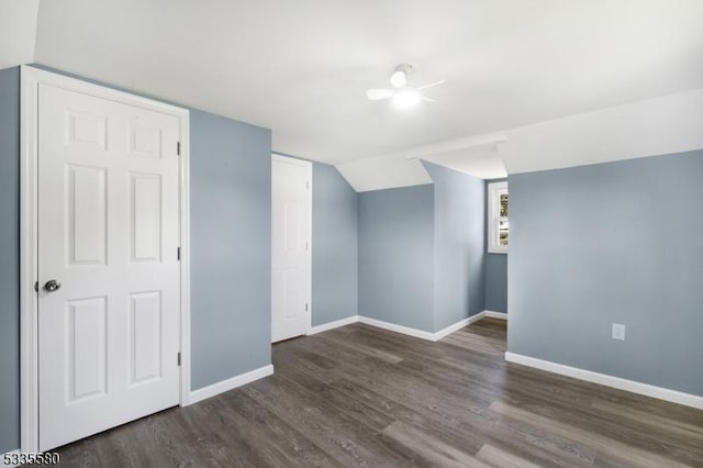 bonus room with dark hardwood / wood-style flooring and lofted ceiling