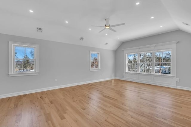 interior space with light wood-type flooring, vaulted ceiling, and ceiling fan