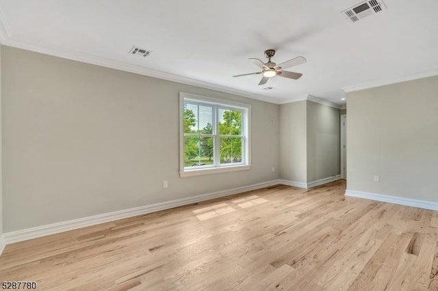 empty room with light hardwood / wood-style flooring, ornamental molding, and ceiling fan